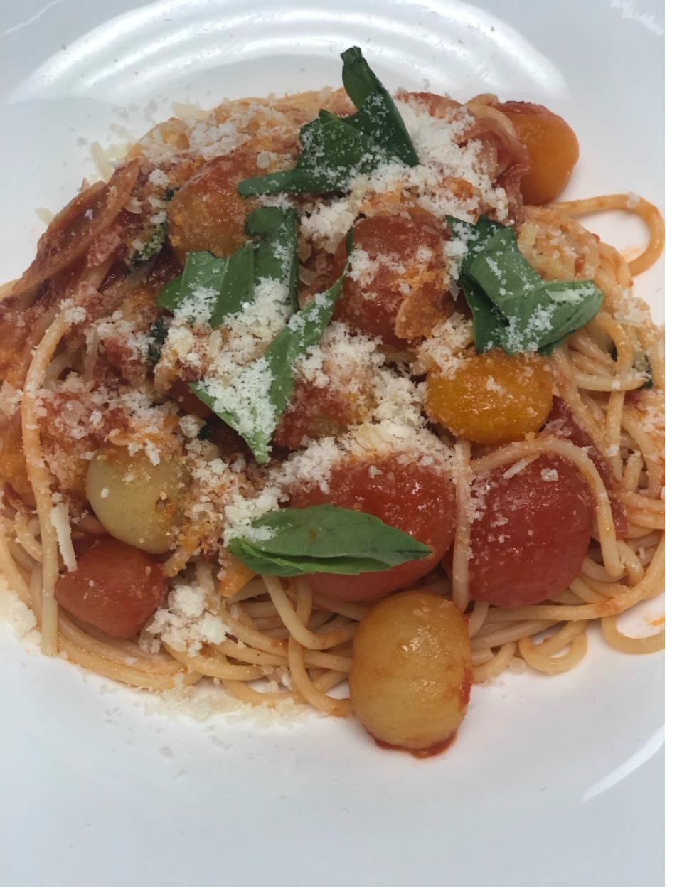 Fresh spaghetti with heirloom cherry tomatoes, basil, and parmesan cheese